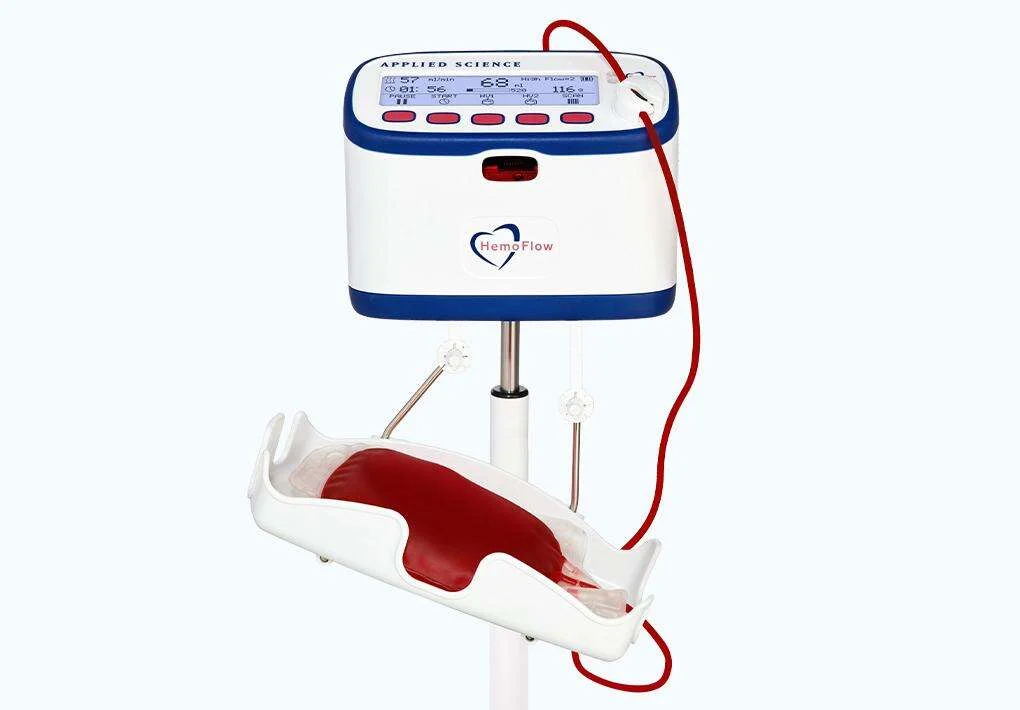 HemoFlow 400 mounted on a floor stand, its suspended tray rocking a filled collection bag mid-draw